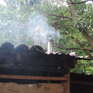 Smoke exiting a house through a chimney