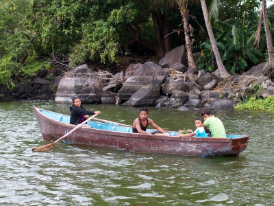 A family in a small wooden boat