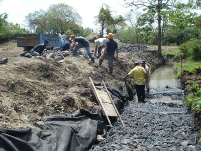 Families helping to build flood defenses