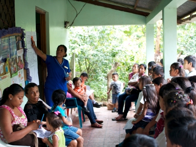 A nurse teaching children