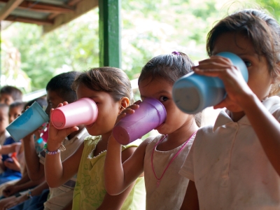 Children enjoying their high-vitamin milk