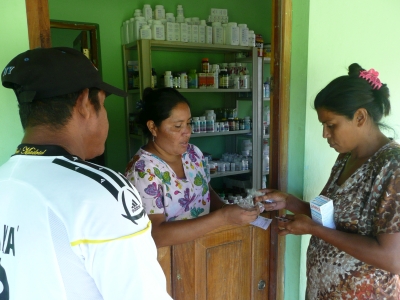 A nurse dispensing medicines to a patient