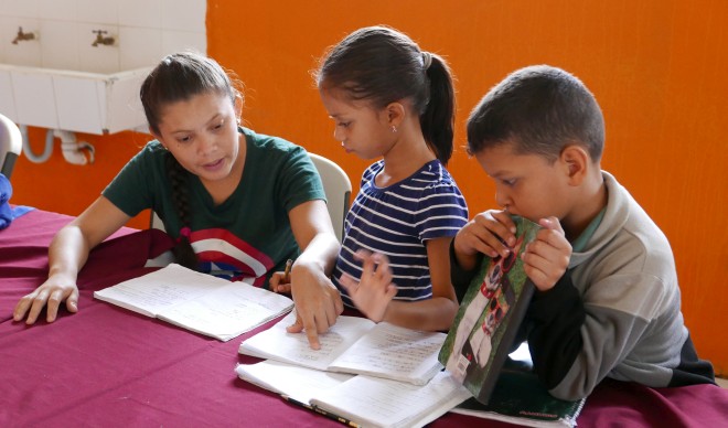Three children at an orphanage