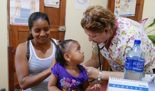 Doctor Sandra treating a young patient