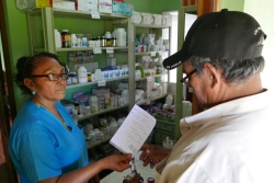 Nurse Candida dispensing medicines to a patient