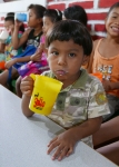 A boy drinking a glass of high-vitamin milk