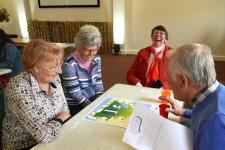 People playing SIFT's board game
