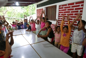 Children singing a song at the Feeding Programme