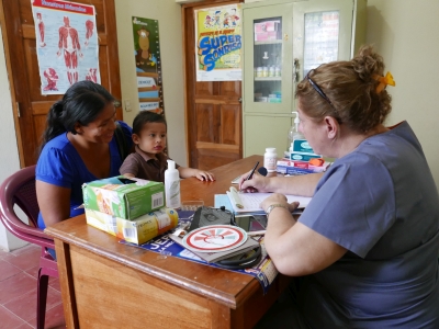 Dr Sandra diagnosing a child